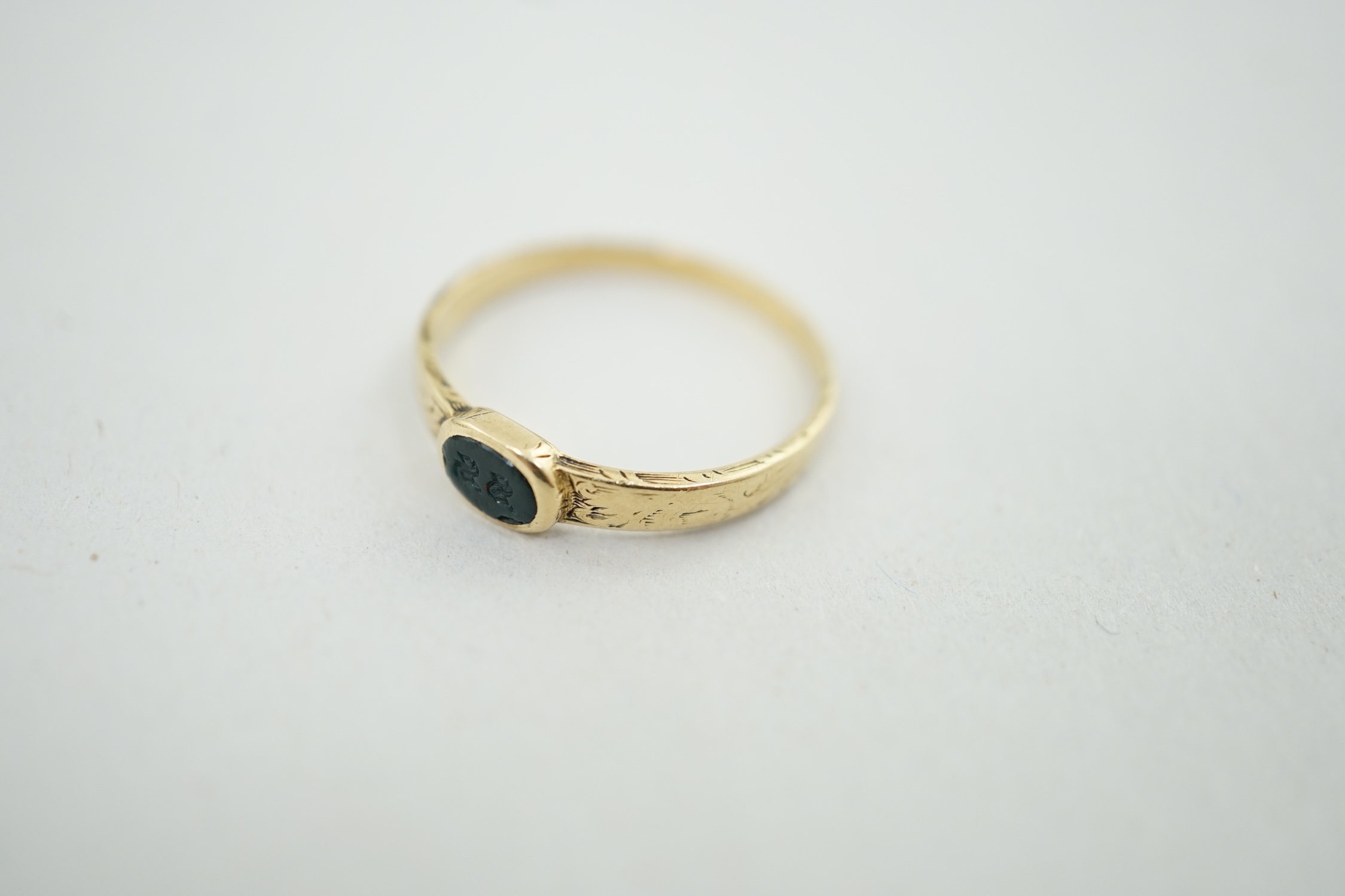 An antique engraved gold and intaglio bloodstone? set ring